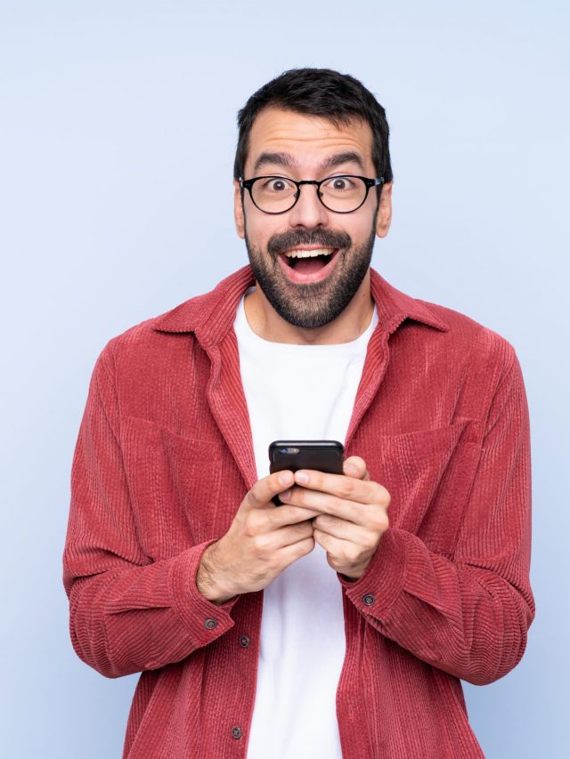 Young,Caucasian,Man,Wearing,Corduroy,Jacket,Over,Blue,Background,Surprised